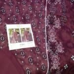 Elegant MTJ lawn 3 piece suit with intricate embroidery and vibrant design. Perfect for summer occas.