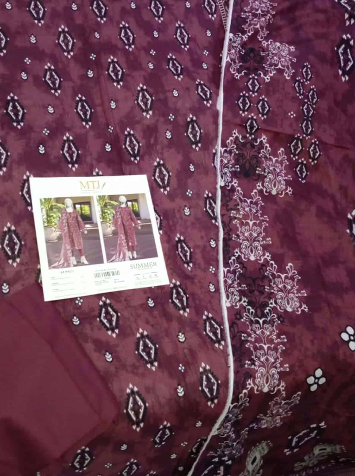 Elegant MTJ lawn 3 piece suit with intricate embroidery and vibrant design. Perfect for summer occas.