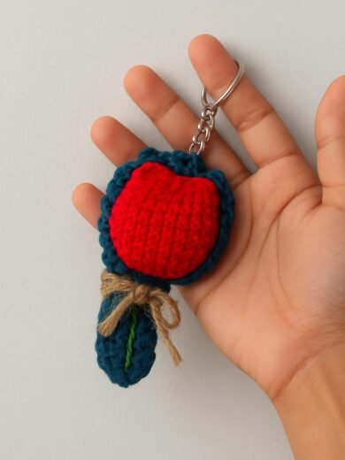 Keychain with red and blue crochet design, handmade accessory.